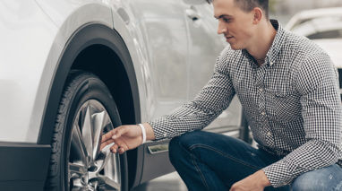 Man checking the air on his tires