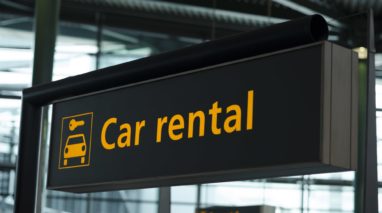 Sign in airport that says car rental