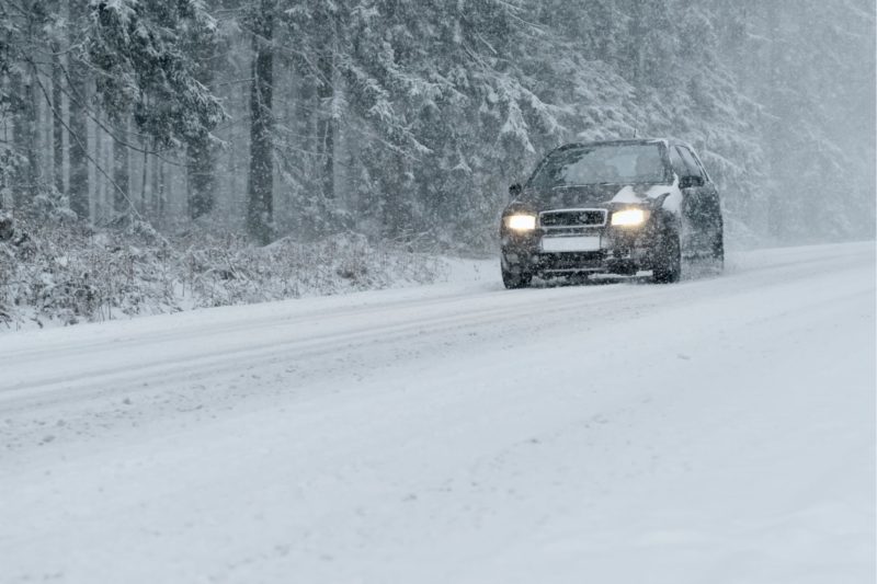 Front view of a car driving in the snow