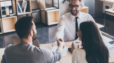 insurance agent providing coverage to customers in an office