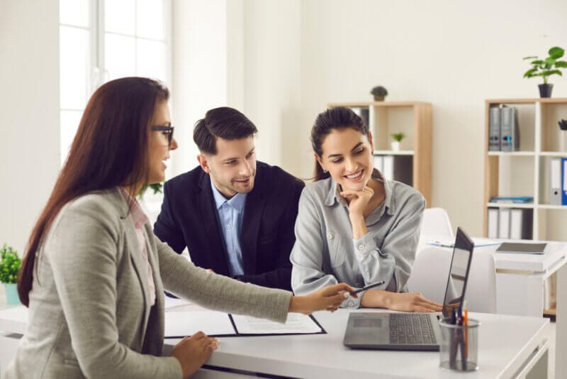 couple with car insurance agent