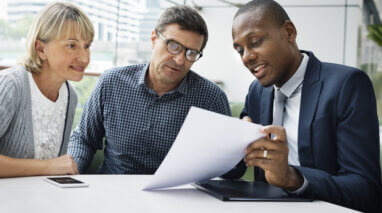 insurance agent explaining policy to customers