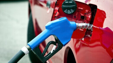 blue gas nozzle in red car