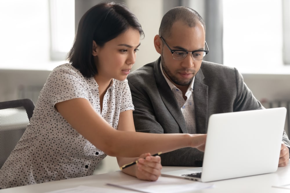 couple looking over laptop 