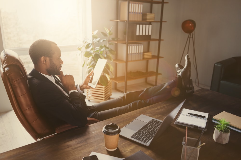 insurance agent reading book at desk