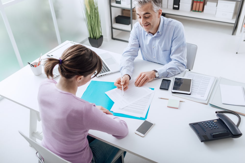 insurance agent working with client