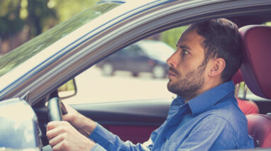 Man looks anxious behind the wheel