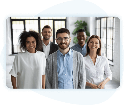 Group of diverse employees posing for picture looking at the camera