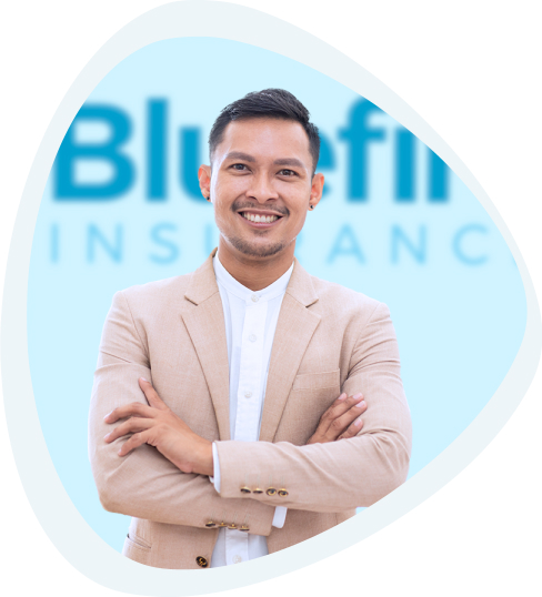 Young businessman stands with arms crossed in front of Bluefire sign.